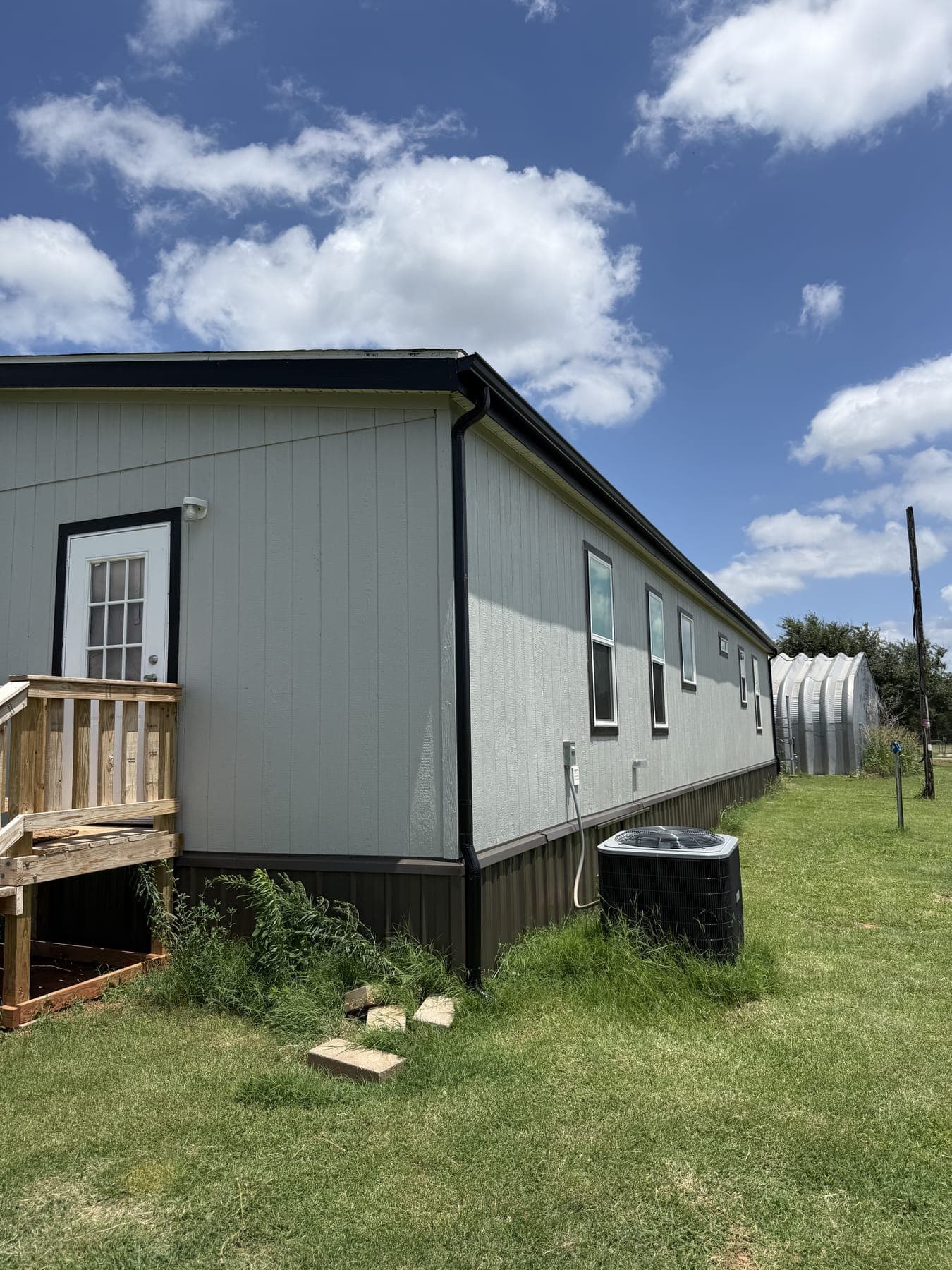 Securely fastened seamless gutters on a rural home near Kingfisher, OK