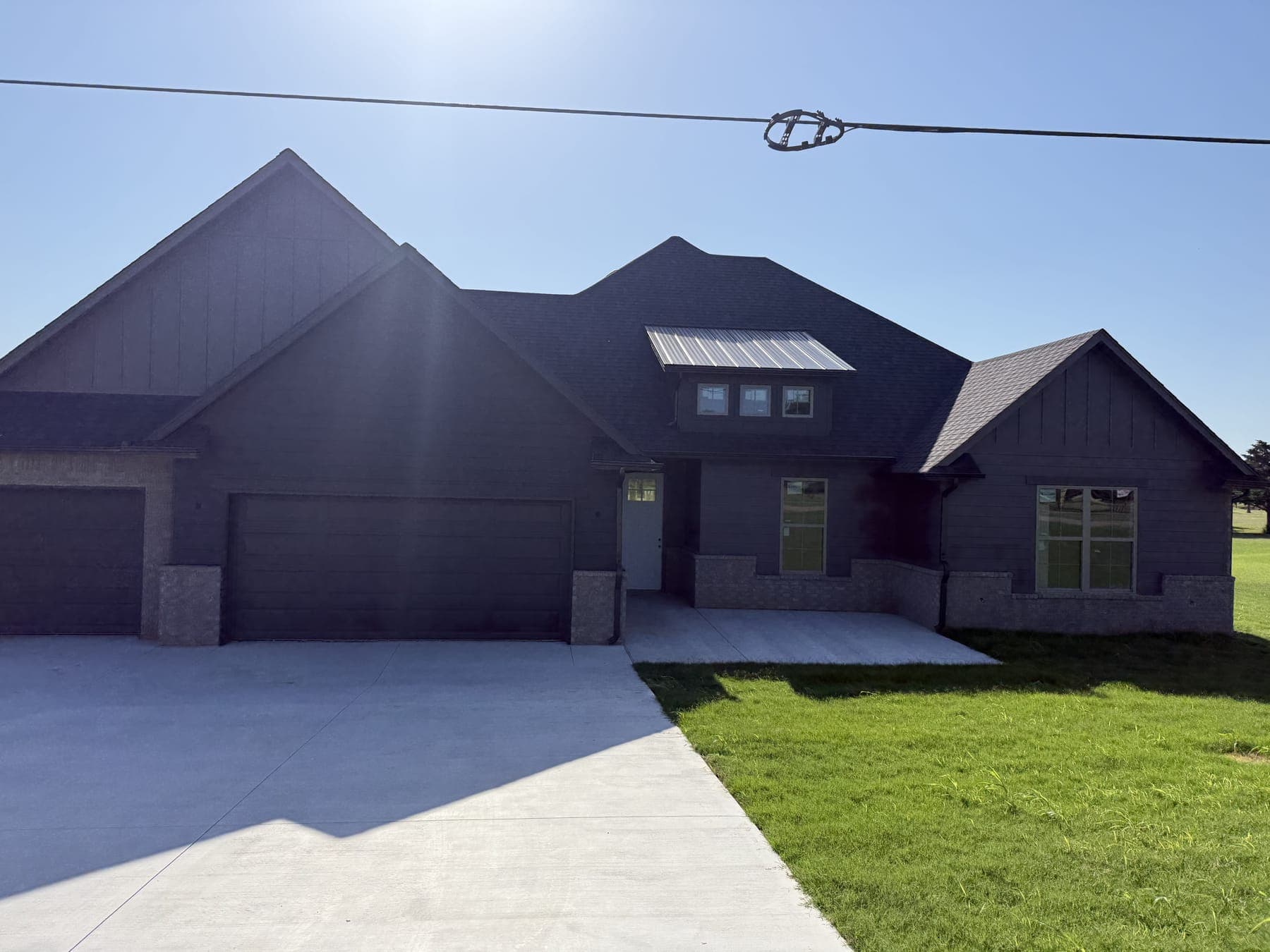 New 5-inch seamless gutters on a large craftsman home in Edmond, OK